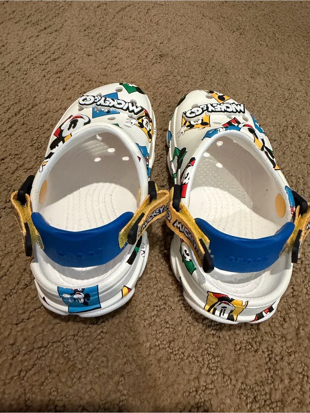 CROCS Kids' White Mickey Mouse Graphic Clogs with Blue and Yellow Accents
